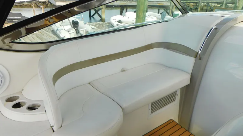  Yacht Photos Pics 2003 Formula 40 PC yacht interior with white seating and wood accents.