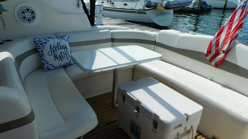 Yacht Photos Pics 2003 Formula 40 PC yacht interior with seating, table, and nautical decor.