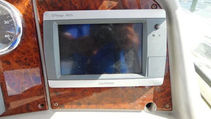  Yacht Photos Pics Garmin GPSmap 740S on 2003 Formula 40 PC boat dashboard, wood panel background.