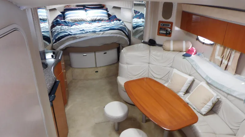  Yacht Photos Pics Interior of 2003 Formula 40 PC yacht with cozy seating and sleeping area.