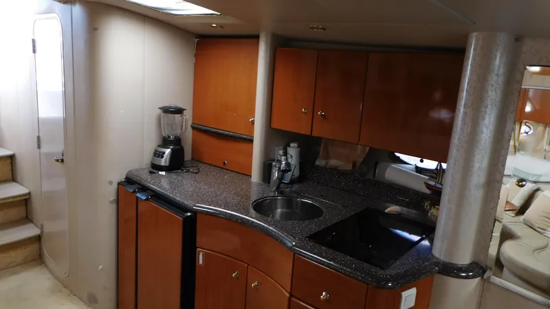  Yacht Photos Pics Interior of a 2003 Formula 40 PC yacht with modern kitchen amenities.