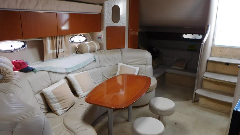  Yacht Photos Pics Luxurious interior of a 2003 Formula 40 PC yacht with plush seating and wooden table.