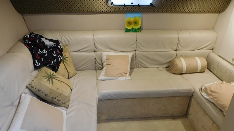  Yacht Photos Pics Luxurious 2003 Formula 40 PC yacht interior with beige leather seating and decorative pillows.