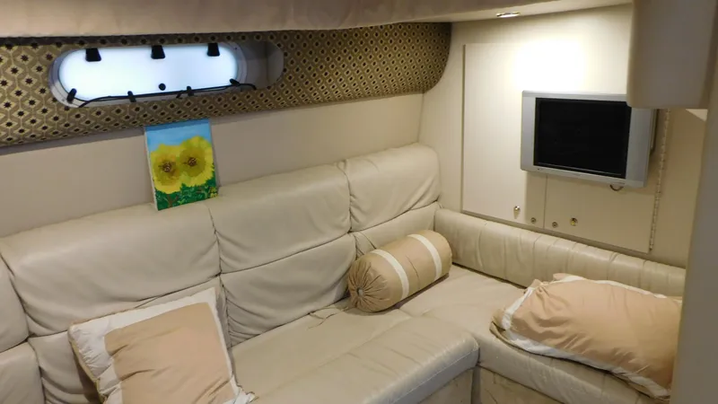  Yacht Photos Pics Interior of 2003 Formula 40 PC yacht with beige seating and wall-mounted TV.