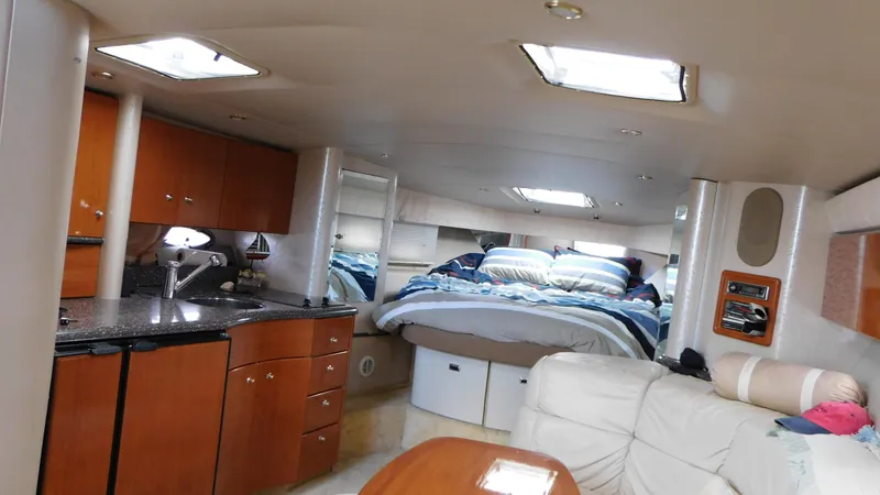  Yacht Photos Pics Interior of a 2003 Formula 40 PC yacht with kitchen and cozy sleeping area.