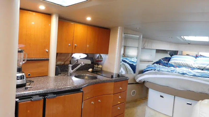  Yacht Photos Pics Interior of 2003 Formula 40 PC yacht with kitchen and cozy sleeping area.