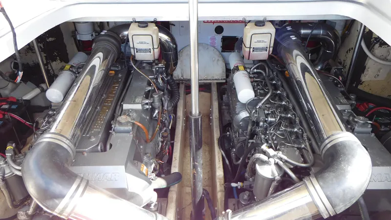  Yacht Photos Pics Engine compartment of a 2003 Formula 40 PC boat, showcasing dual engines and mechanical components.