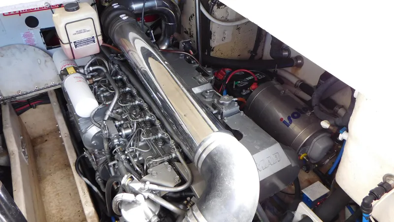  Yacht Photos Pics Engine compartment of a 2003 Formula 40 PC boat, showcasing mechanical components and wiring.