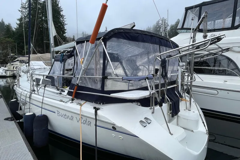 Buena Vida Yacht Photos Pics Catalina 42 MkII sailboat, 2000 model, docked in a marina with protective canopy.