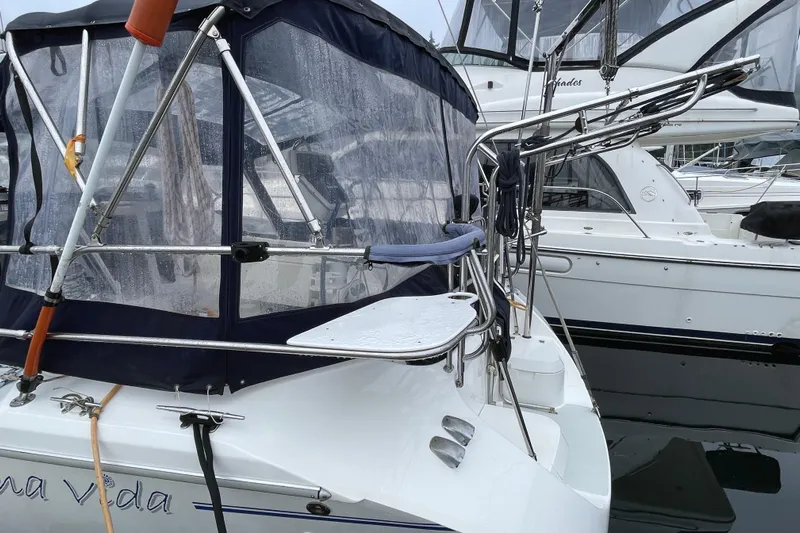Buena Vida Yacht Photos Pics Catalina 42 MkII sailboat, 2000 model, docked with protective canopy and stainless steel railings.