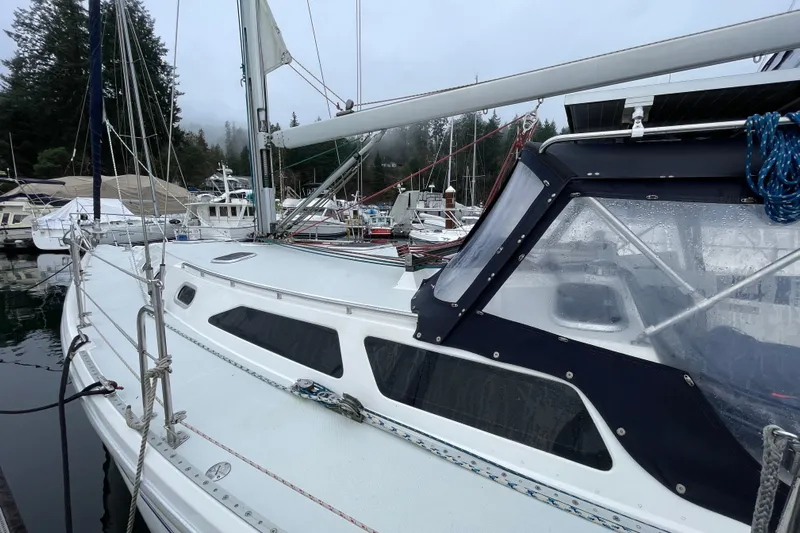 Buena Vida Yacht Photos Pics Sailboat Catalina 42 MkII, 2000 model, docked in a marina on a cloudy day.