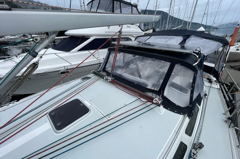 Buena Vida Yacht Photos Pics 2000 Catalina 42 MkII sailboat docked, featuring a sleek deck and protective canopy.