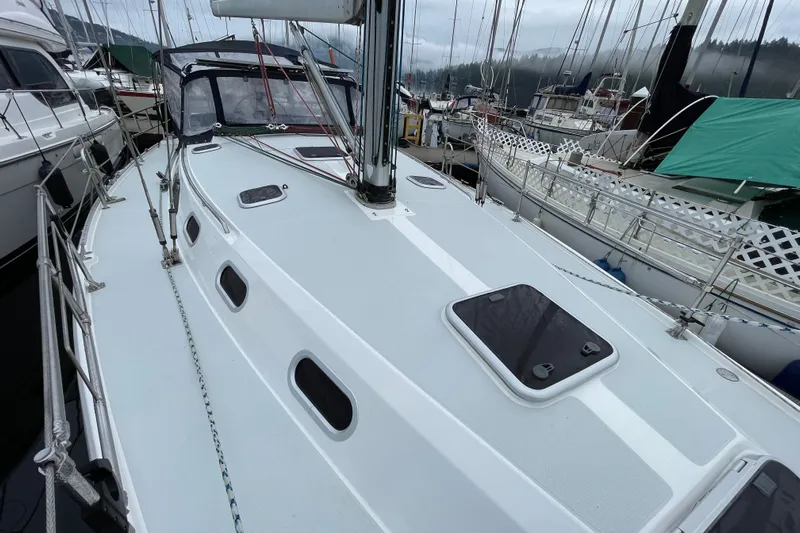 Buena Vida Yacht Photos Pics Sailboat Catalina 42 MkII, 2000 model, docked in a marina with overcast skies.