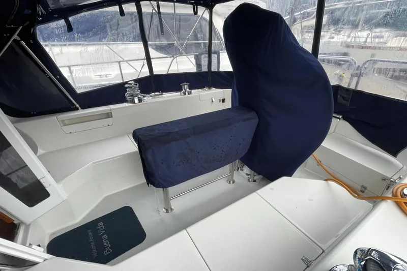 Buena Vida Yacht Photos Pics Cockpit of 2000 Catalina 42 MkII sailboat with blue covers and visible winches.