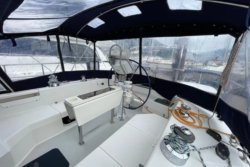 Buena Vida Yacht Photos Pics Cockpit of a 2000 Catalina 42 MkII sailboat with steering wheel and winches.