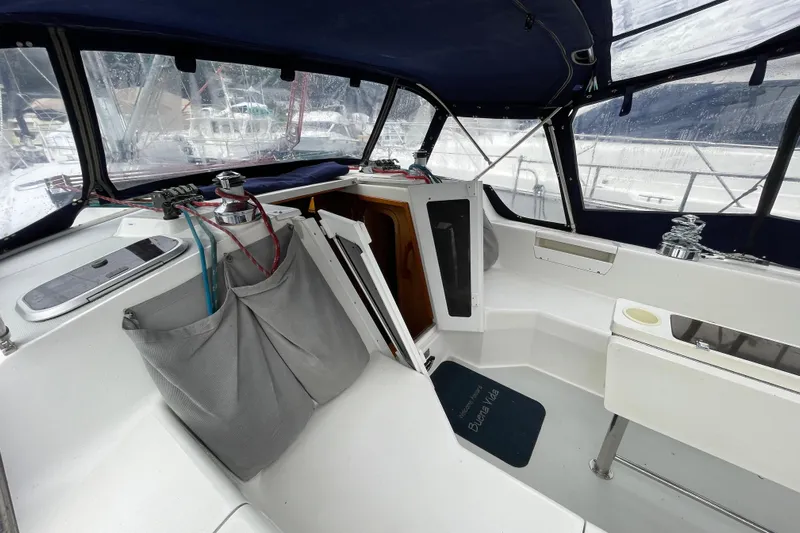 Buena Vida Yacht Photos Pics Cockpit of 2000 Catalina 42 MkII sailboat with covered seating and winches.