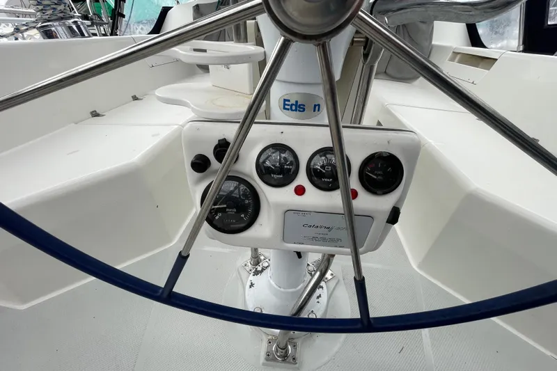 Buena Vida Yacht Photos Pics Steering wheel and instrument panel of 2000 Catalina 42 MkII sailboat cockpit.