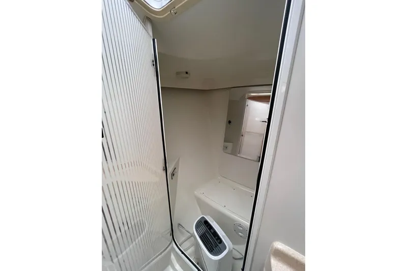 Buena Vida Yacht Photos Pics Bathroom interior of 2000 Catalina 42 MkII sailboat, featuring compact design and modern fixtures.