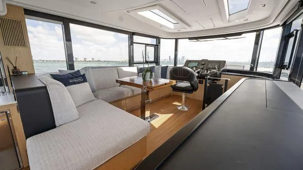  Yacht Photos Pics Luxurious interior of 2024 OKEAN 52 yacht with modern seating and panoramic windows.