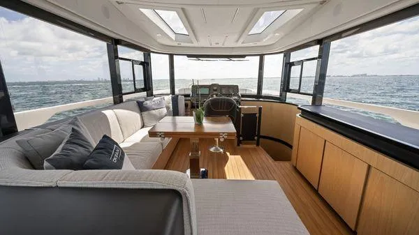  Yacht Photos Pics Luxurious interior of 2024 OKEAN 52 yacht with panoramic ocean views and modern furnishings.