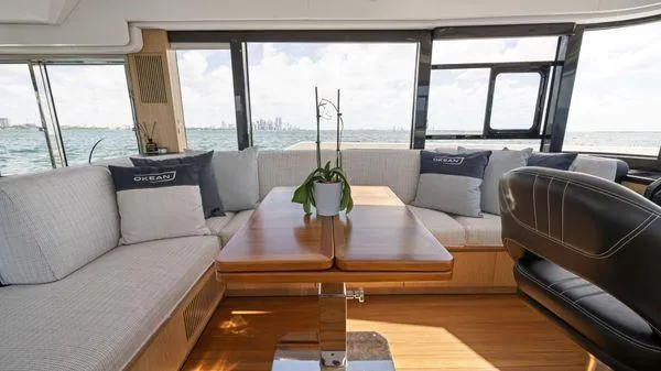  Yacht Photos Pics Luxurious interior of 2024 OKEAN 52 yacht with elegant seating and ocean view.