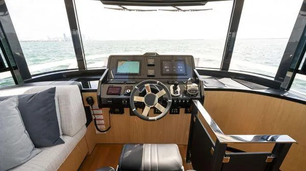  Yacht Photos Pics 2024 OKEAN 52 yacht helm with modern controls and panoramic ocean view.