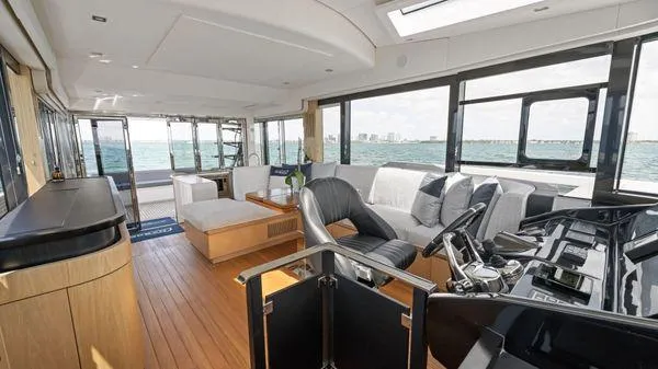  Yacht Photos Pics Luxurious interior of 2024 OKEAN 52 yacht with modern seating and ocean view.