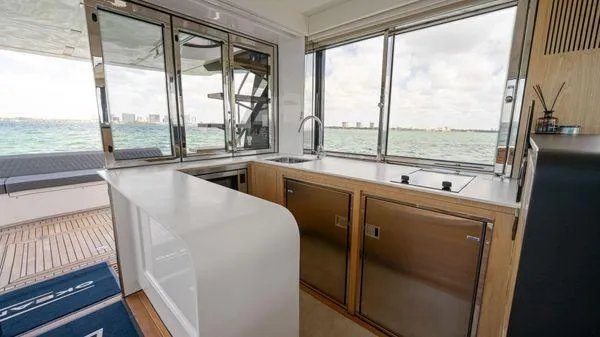  Yacht Photos Pics 2024 OKEAN 52 yacht interior with modern kitchen and ocean view.