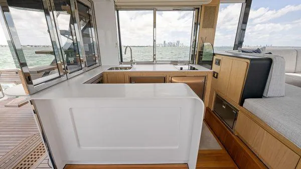  Yacht Photos Pics Modern interior of 2024 OKEAN 52 yacht with sleek kitchen and ocean view.