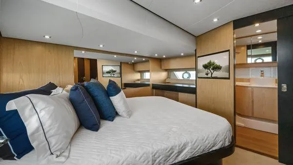 Yacht Photos Pics Luxurious bedroom interior of 2024 OKEAN 52 yacht with modern design and elegant decor.