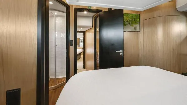  Yacht Photos Pics Luxurious interior of 2024 OKEAN 52 yacht with modern wood paneling and elegant design.