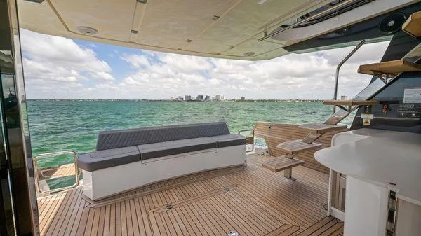  Yacht Photos Pics Luxurious 2024 OKEAN 52 yacht deck with ocean view and modern seating.