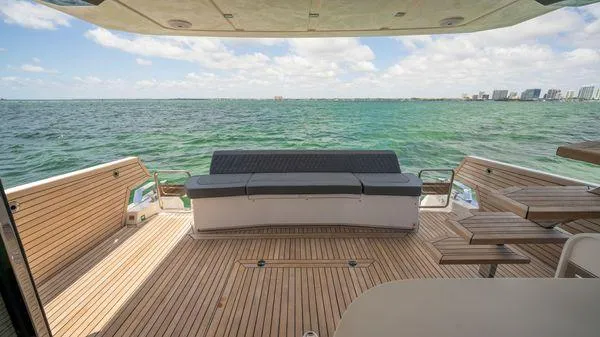 Yacht Photos Pics Luxury deck of 2024 OKEAN 52 yacht with ocean view and seating area.