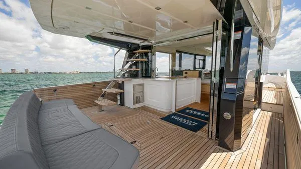  Yacht Photos Pics Luxurious 2024 OKEAN 52 yacht with spacious deck and modern interior design.