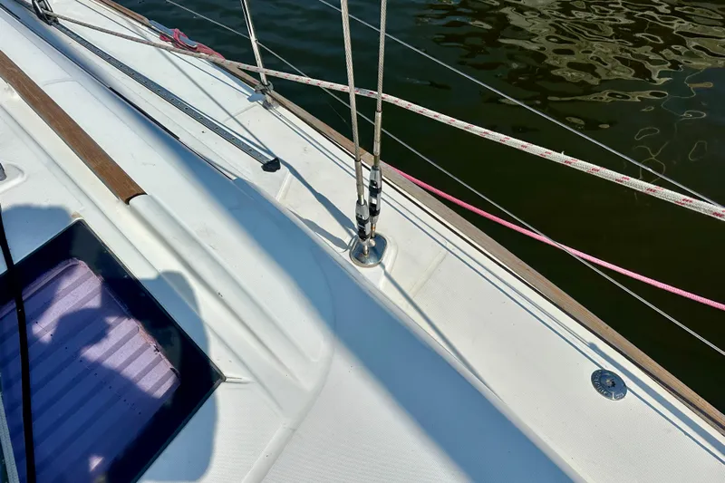  Yacht Photos Pics Deck of 2010 Beneteau Oceanis 40 sailboat with rigging and water reflection.