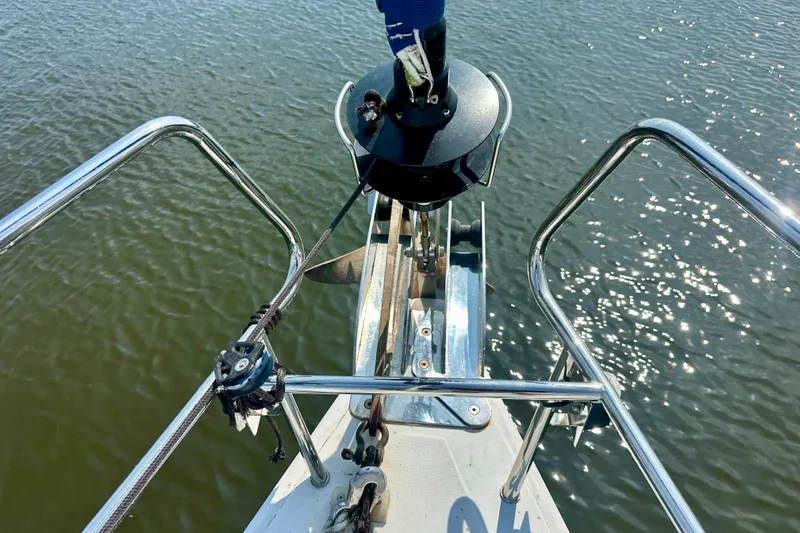  Yacht Photos Pics Bow of 2010 Beneteau Oceanis 40 sailboat with anchor over water.