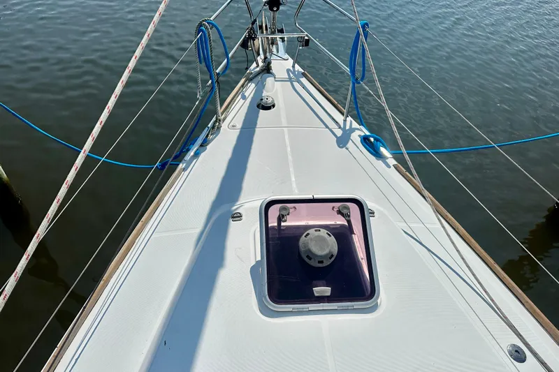  Yacht Photos Pics Deck view of a 2010 Beneteau Oceanis 40 sailboat with ropes and hatch.