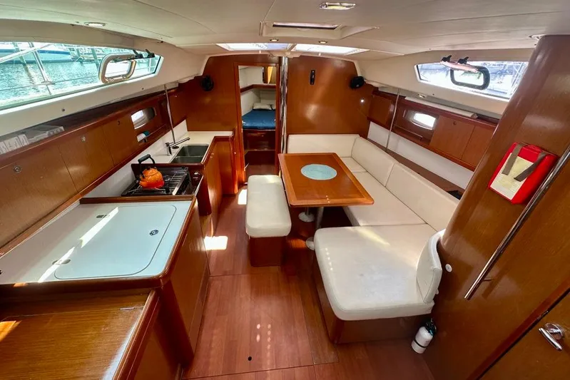  Yacht Photos Pics Interior of 2010 Beneteau Oceanis 40 yacht with kitchen and seating area.