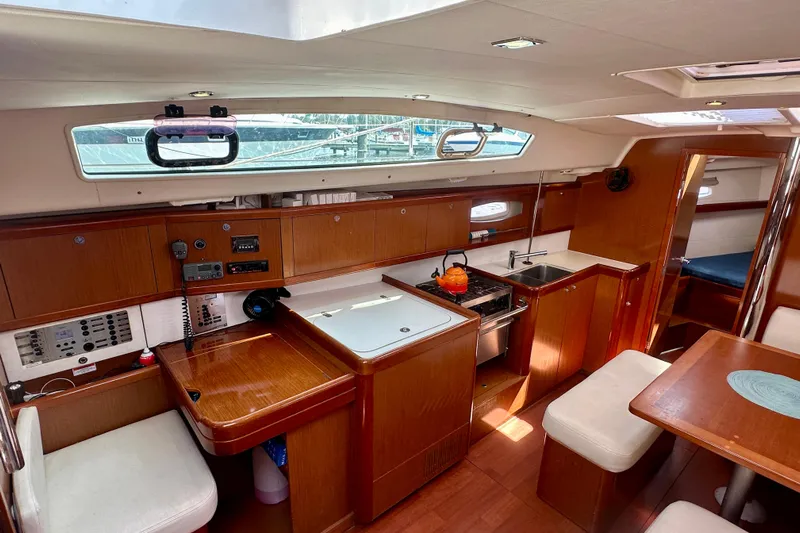  Yacht Photos Pics Interior of 2010 Beneteau Oceanis 40 yacht, featuring a modern kitchen and dining area.
