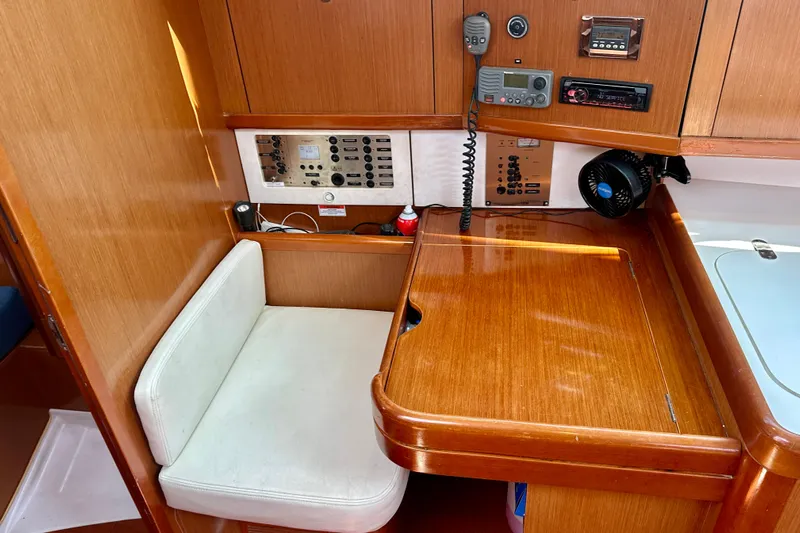  Yacht Photos Pics Interior of 2010 Beneteau Oceanis 40 sailboat with navigation station and control panel.