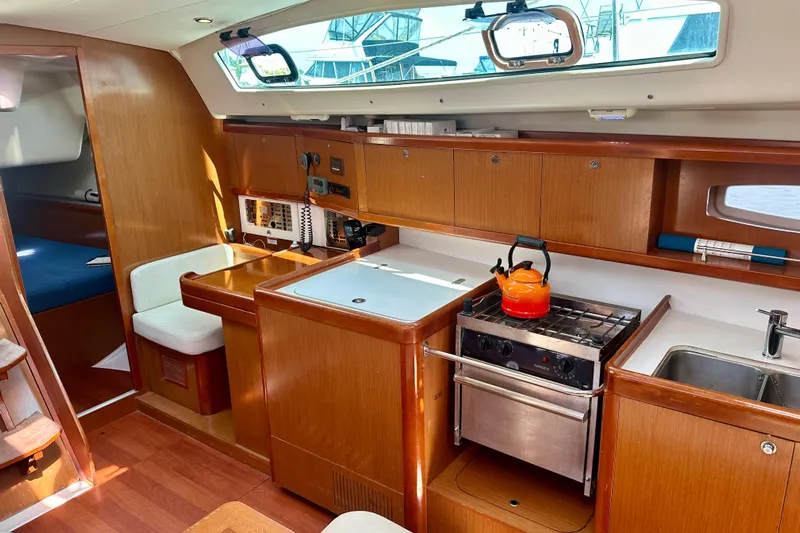  Yacht Photos Pics Interior of 2010 Beneteau Oceanis 40 yacht with kitchen and seating area.