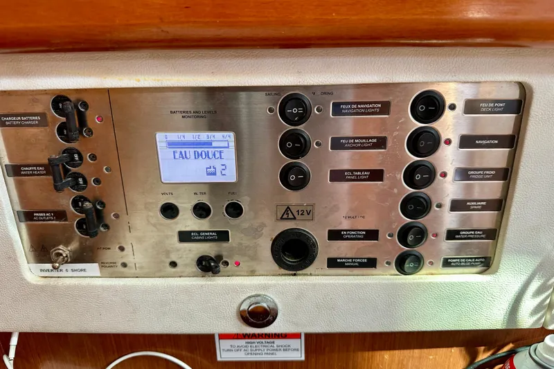  Yacht Photos Pics Control panel of a 2010 Beneteau Oceanis 40 sailboat, featuring various switches and indicators.