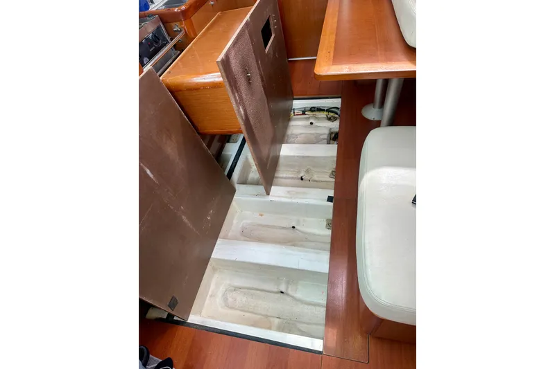  Yacht Photos Pics Interior view of 2010 Beneteau Oceanis 40 sailboat with open floor panel.