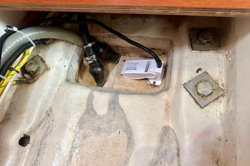  Yacht Photos Pics Bilge area of 2010 Beneteau Oceanis 40 sailboat with hoses and wiring.