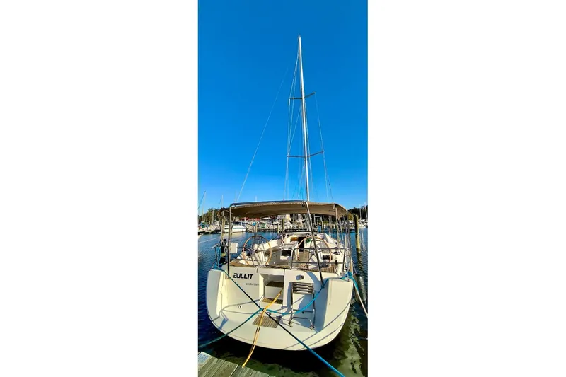  Yacht Photos Pics 2011 Beneteau Oceanis 40 sailboat docked at marina under clear blue sky.