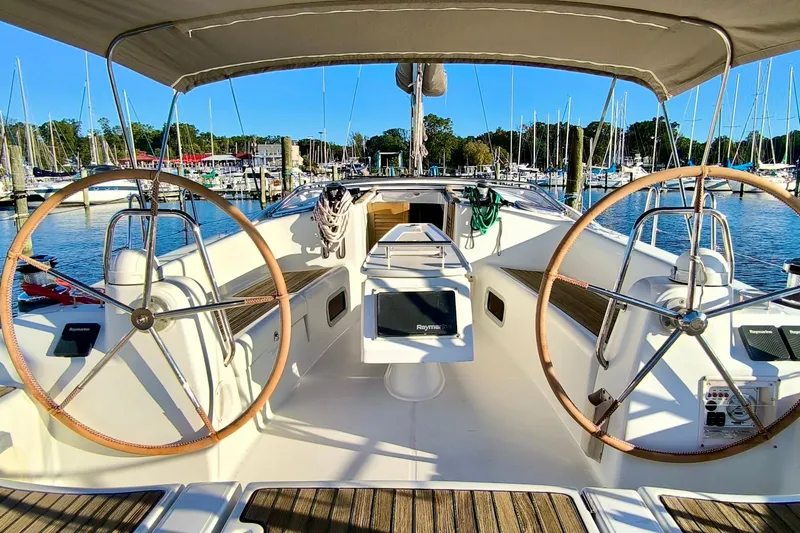 Yacht Photos Pics 2011 Beneteau Oceanis 40 sailboat cockpit with dual steering wheels, docked at marina.