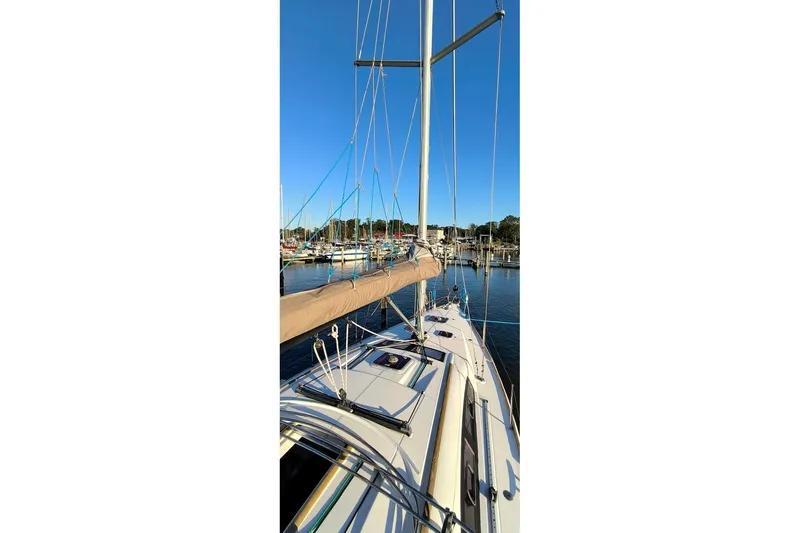  Yacht Photos Pics Sailboat Beneteau Oceanis 40, 2011 model, docked at marina under clear blue sky.