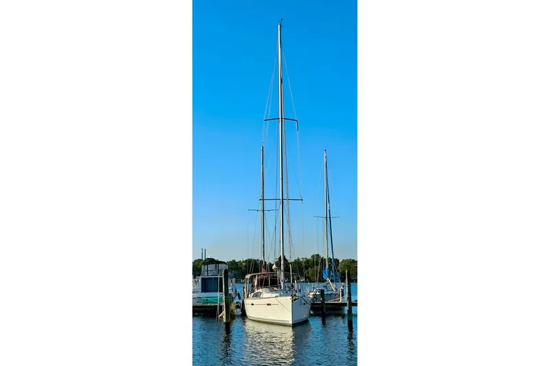  Yacht Photos Pics 2011 Beneteau Oceanis 40 sailboat docked in a marina under clear blue skies.