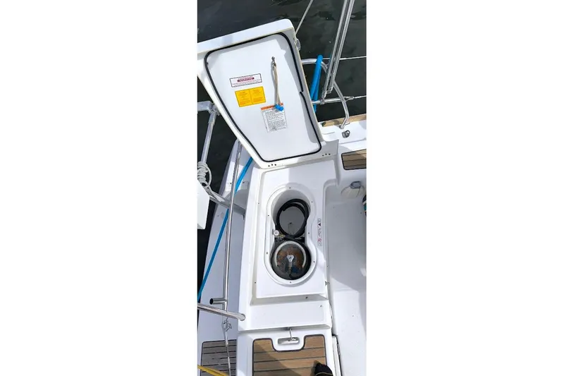  Yacht Photos Pics Open hatch on 2011 Beneteau Oceanis 40 sailboat, showing storage compartment.