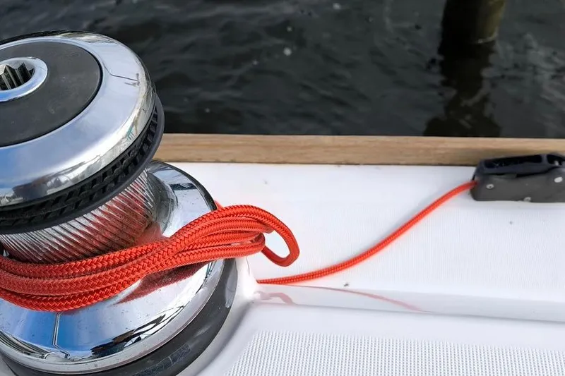  Yacht Photos Pics Winch with red rope on 2011 Beneteau Oceanis 40 sailboat deck.